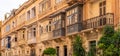 Residential house facade with traditional Maltese wooden balconies in Sliema, Malta
