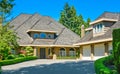 Residential house with massive roofs on blue sky background