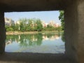 Residential house reflected in water.