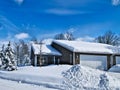 Residential house with snow on the roof in winter