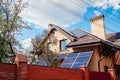 Residential house with solar panels on roof. Alternative energy. Using sun power for home. Conservation