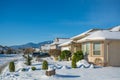 Residential house on winter sunny day decorated for Christmas celebration Royalty Free Stock Photo