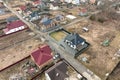 Residential houses with roof tops covered with metallic and ceramic shingles in rural suburban area