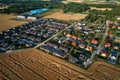 Residential houses in small town near agricultural field, aerial view Royalty Free Stock Photo