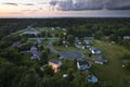 Residential illuminated homes at sunset in suburban sprawl development in Rochester, New York. Low-density two story Royalty Free Stock Photo