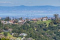 Residential neighborhood on the hills of San Francisco peninsula, Silicon Valley, San Mateo bridge in the background, California Royalty Free Stock Photo