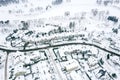 Residential neighborhood near river with snow-covered homes after big snowstorm. aerial view Royalty Free Stock Photo