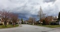 Residential neighborhood Street in Modern City Suburbs. Cloudy Day. Royalty Free Stock Photo