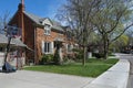 street with traditional brick detached houses