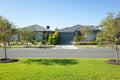 Residential neighbourhood street with some modern Australian homes. The beautiful environment in Melbourne`s suburb. Royalty Free Stock Photo