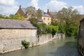 Residential properties on the River Windrush in Witney, Oxfordshire in the UK