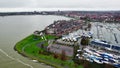 Residential street and marina quay flooded by storm Henk in the Netherlands Aerial view