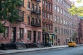 Residential Street in Hell\'s Kitchen of New York City with Old Apartment Buildings