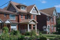 Residential street with large detached brick houses