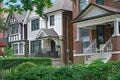 Residential street with large detached brick houses