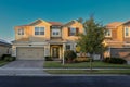 Residential street with modern two story houses at sunset Royalty Free Stock Photo