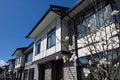 Residential townhouses on blue sky background on sunny day. External facade of a row of colorful modern urban townhouses.brand new Royalty Free Stock Photo