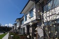 Residential townhouses on blue sky background on sunny day. External facade of a row of colorful modern urban townhouses.brand new Royalty Free Stock Photo