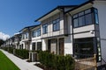 Residential townhouses on blue sky background on sunny day. External facade of a row of colorful modern urban townhouses.brand new Royalty Free Stock Photo