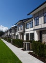 Residential townhouses on blue sky background on sunny day. External facade of a row of colorful modern urban townhouses.brand new Royalty Free Stock Photo