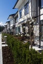 Residential townhouses on blue sky background on sunny day. External facade of a row of colorful modern urban townhouses.brand new Royalty Free Stock Photo