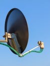 Residential TV receiver satellite dish with low-noise block downconverter LNB. Satellite dish antenna with octo monoblock Royalty Free Stock Photo