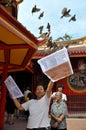 Residents of Chinese descent in Jakarta perform the ritual of releasing birds at a monastery in Glodok, Jakarta - Indonesia Royalty Free Stock Photo