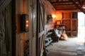 Residents in a rustic barn activate smart lighting and security systems, illustrating modern conveniences.