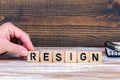 Resign. Wooden letters on the office desk, informative and communication background Royalty Free Stock Photo