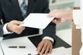 resignation, leave, quit, Stressful businesswomen will resign from the company. Female staff is lifting a brown paper box that Royalty Free Stock Photo