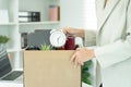 resignation, leave, quit, Stressful businesswomen will resign from the company. Female staff is lifting a brown paper box that Royalty Free Stock Photo