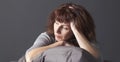 Resigned senior woman sick of having menopause blues