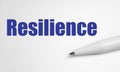 Resilience word concept written with pen on white background