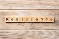 Resilience word written on wood block. resilience text on table, concept