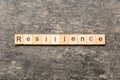 resilience word written on wood block. resilience text on table, concept