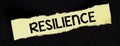 RESILIENCE written on a small yellow piece of paper