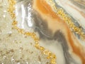 Resin art abstract with golden colors and glass. Epoxy resin art painting space. Epoxy background