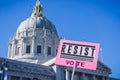 `Resist` sign raised at the Women`s March rally which took place in the Civic Center Plaza