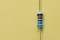 Resistor isolated on yellow background