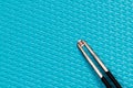 220? resistor and tweezers on a blue background Royalty Free Stock Photo