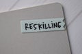 Reskilling text on sticky notes with office desk Royalty Free Stock Photo