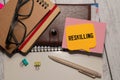 Reskilling text on sticky notes with office desk Royalty Free Stock Photo
