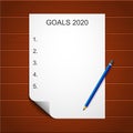 Resolution list, goals, plan for new year 2020. Empty template of resolution on sheet, notebook on wooden table. Personal growth