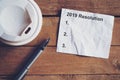 Resolution for 2019 word on paper with pen and coffee cup on woo Royalty Free Stock Photo