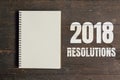 2018 Resolutions and Brown note book open on wood table background with space. Royalty Free Stock Photo