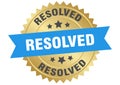 resolved. resolved round blue and gold label isolated on transparent background