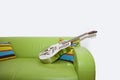 Resonator Guitar on a Green Sofa Royalty Free Stock Photo