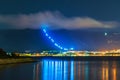 Resort city Gelendzhik with mountains and night illumination reflected in sea bay water Royalty Free Stock Photo