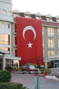Resort of Kemer, Turkey. The big Turkish state flag is deployed on the building of the hotel