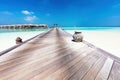 Resort in Maldives. Water villas along wooden jetty Royalty Free Stock Photo